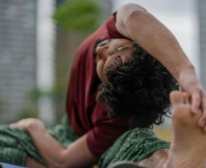 Close-up of a person in a deep, mindful stretch.